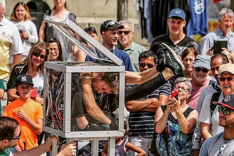 Australian contortionist Emma Kerger (above) aims to squeeze into a 40cm perspex box. Covent Garden performers such as stilt jumping duo Jump Stilts Extreme (above) and "strong lady" Betty Brawn (above left) are part of the line-up at the Clarke Quay