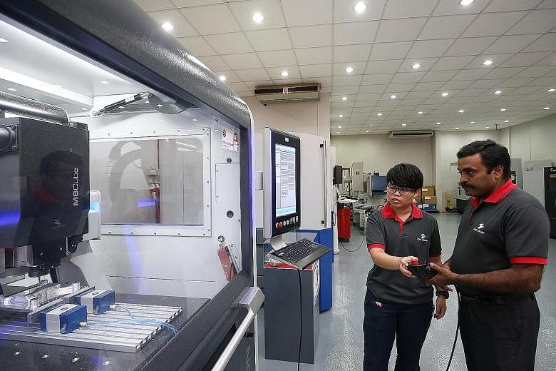 Ichi Seiki application engineer Chui Kher Ning has trained fellow application engineer Krishnan Thiagarajan to use the company's new precision engineering machines, after she was trained by German specialists last year.