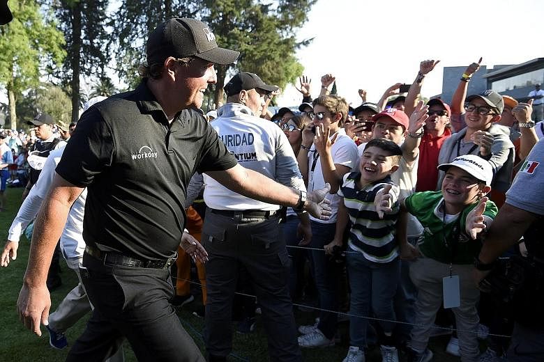 WGC-Mexico Championship winner Phil Mickelson being greeted by fans after his play-off success over world No. 2 Justin Thomas on Sunday. The 47-year-old American had not won since the 2013 British Open, a run of 101 events.