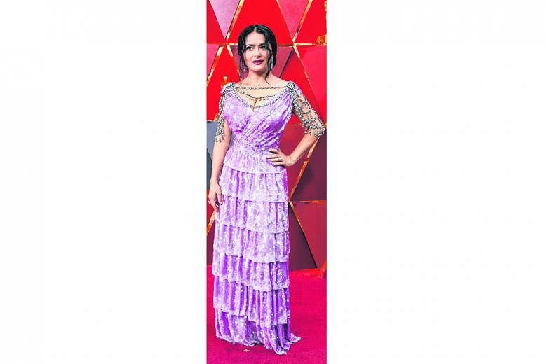 More is not always better - as is the case of actress Salma Hayek's Gucci number, which has way too much going on with its overly kitschy lavender colour, all-over sequins, tiers and crystal body chains.