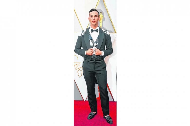 Olympic figure skater Adam Rippon might have just won himself a bronze at the games, but he is unlikely to win any awards for this Moschino look, complete with a bondage-style harness and exposed shoulders.