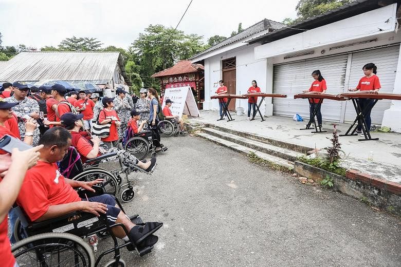 Mr Jurani Basri (above) was among 120 wheelchair users who toured Pulau Ubin last Friday with their caregivers and chaperones. The beneficiaries also enjoyed musical performances by polytechnic students.