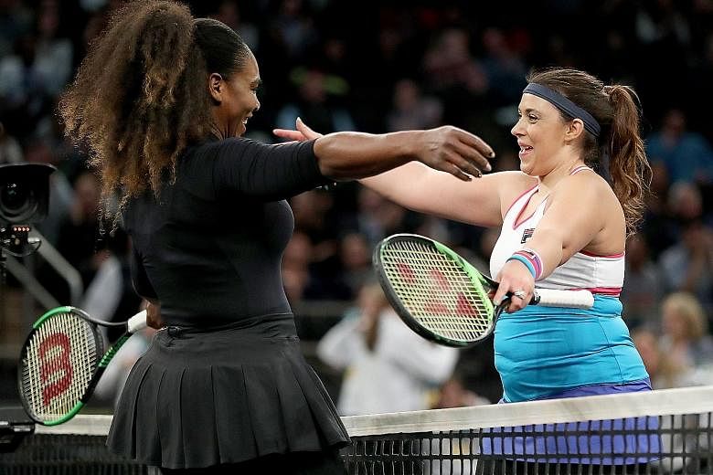 Marion Bartoli congratulating Serena Williams after the latter won their opening Tie Break Tens match at Madison Square Garden on Monday. Williams, who lost in the next round to China's Zhang Shuai, is making her return to the WTA Tour at Indian Well