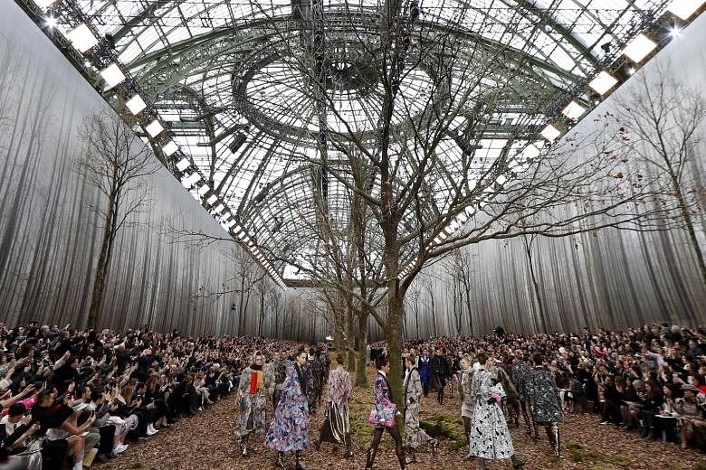 Chanel re-created a misty forest inside the Grand Palais on Tuesday, the final day of Paris Fashion Week, but environmental activists accused the storied French brand of felling century-old trees for a fashion show. Trees had also been chopped down t