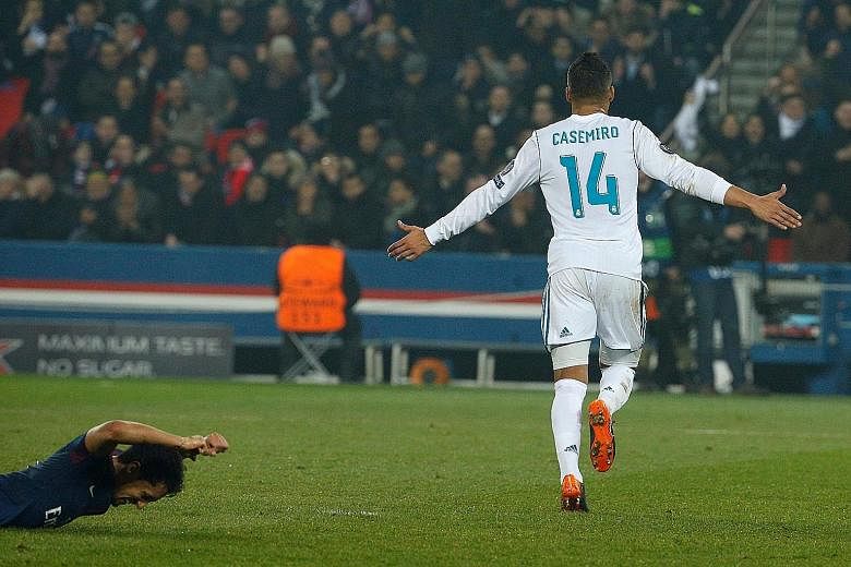 Top: Real Madrid's Casemiro celebrating his winner in the Champions League last 16 second leg at Paris Saint-Germain. Team-mate Cristiano Ronaldo opened the scoring before Edinson Cavani equalised. Real won 2-1 to advance 5-2 on aggregate. Above: PSG