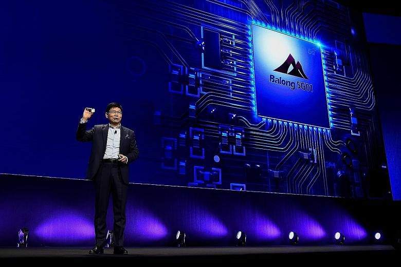 Huawei chief executive for consumer business Richard Yu presenting the new Huawei Balong 5G01, a 3GPP 5G commercial chipset, on Feb 25 in Barcelona, on the eve of the inauguration of the Mobile World Congress.
