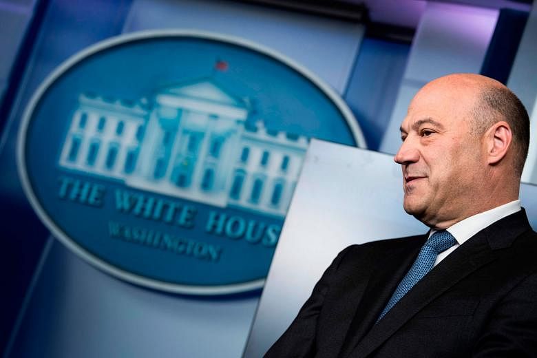 (From top) Dr Peter Navarro, Mr Wilbur Ross and Mr Robert Lighthizer will be left running the US trade policy, after the resignation of top economic adviser Gary Cohn (right).