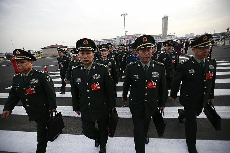 Military delegates arriving for the 13th National People's Congress in Beijing on Monday.