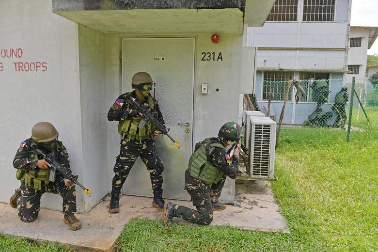 Philippine troops in a drill at the Murai Urban Training Facility in Lim Chu Kang as part of an exchange with the Singapore Armed Forces last December. Unless the guardians of security in the region move from counter-terrorism cooperation to collabor
