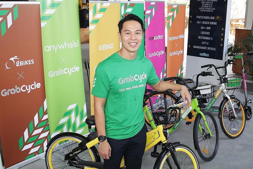 GrabVentures head Reuben Lai (above) says Grab will partner venue owners to roll out dedicated GrabCycle parking areas. On Sentosa (top), it aims to offer more than 10 parking areas.