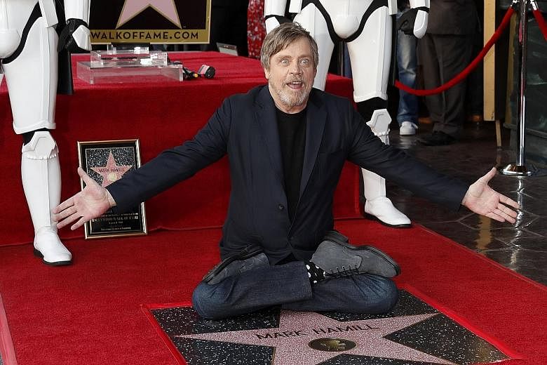 Flanked by two Storm Troopers, Star Wars actor Mark Hamill (left) received a star on the Hollywood Walk of Fame on Thursday with the enthusiasm and humility that has endeared him to fans for four decades. Hamill, 66, told the cheering crowd: "You are