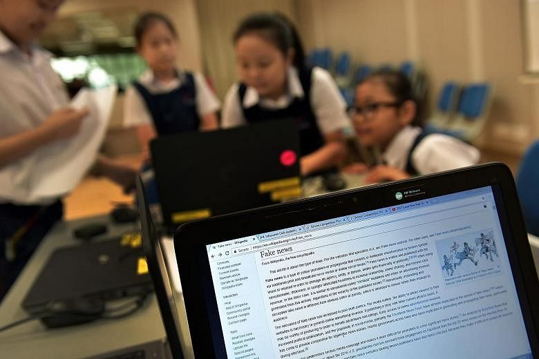 Pupils from Teck Whye Primary School working on their project "Maisipoo Tackles Fake News" last year. In January this year, Parliament voted to form a Select Committee to look into the challenges and implications posed by online falsehoods. The commi