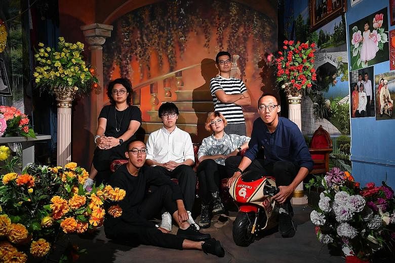 The people behind the urban guide, The City Ramble Stories (left), include (above from left) Ms Stella Gwee, Mr Lim Zeharn, Mr Ryan Len, Ms Ella Zheng, Mr Adib Jalal and Mr Lim Zeherng. They are at Sajeev Digital Studio, a stop featured in the guideb