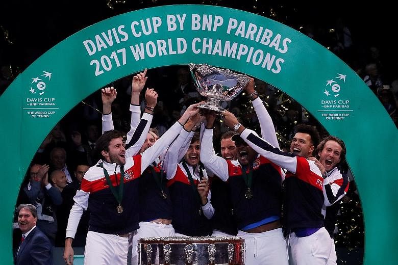 France celebrating with the trophy after winning the Davis Cup final at Stade Pierre Mauroy, Lille, last November. They overcame Belgium 3-2 in the 106th edition of the annual competition.