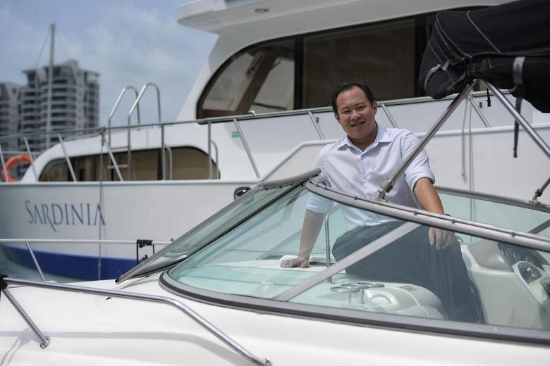 Mr Ng Kah Meng with his yachts at One Degree 15 Marina Club in Sentosa Cove. He is a firm believer in teamwork, “as no one can do everything or consider all angles by himself”. That is why his yacht charter firm is called BOB Marine, with BOB standing for