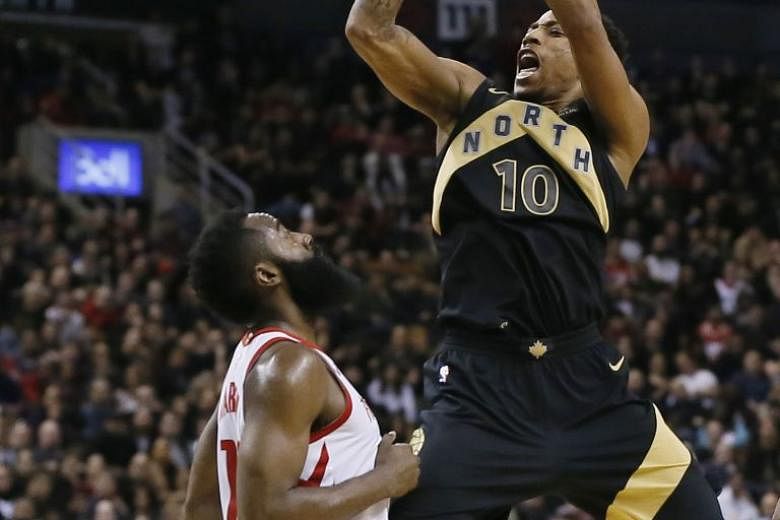 Toronto guard DeMar DeRozan going up for a shot, as Houston guard James Harden is slow to block him at the Air Canada Centre. Harden’s 40 points came to nought for the Rockets, who paid the price for a poor start.