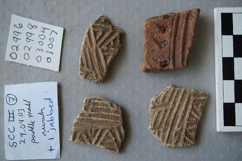 Fragments of low-fired kitchenware, featuring decorative grooves and patterns, uncovered at the Singapore Cricket Club excavation.