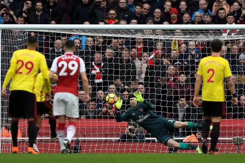 Arsenal's veteran goalkeeper Petr Cech saving Troy Deeney's penalty to keep his clean sheet and his side's two-goal lead intact. It was the Czech custodian's first spot-kick save since February 2011 for former club Chelsea.