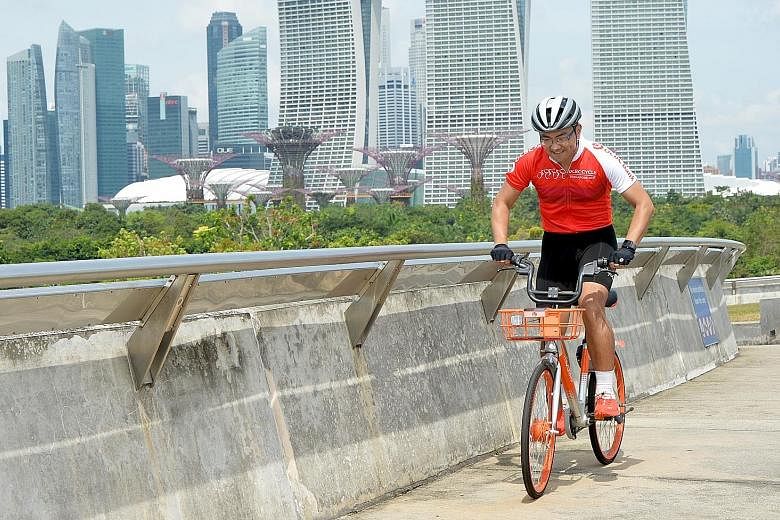 Information technology professional Wan Liu Yang on a Mobike. The latest batch of Mobikes - equipped with a three-speed gear system and adjustable seats - will be made available to participants of the OCBC Cycle from May 5-6 for free.