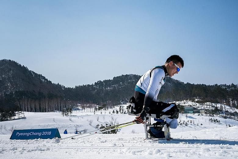 North Korean Kim Jong Hyon competing in the men's 15km sitting cross-country skiing event in Pyeongchang, South Korea. The 17-year-old and fellow rookie skier Ma Yu Chol, 27, were making their country's Winter Paralympics debut yesterday. Although th