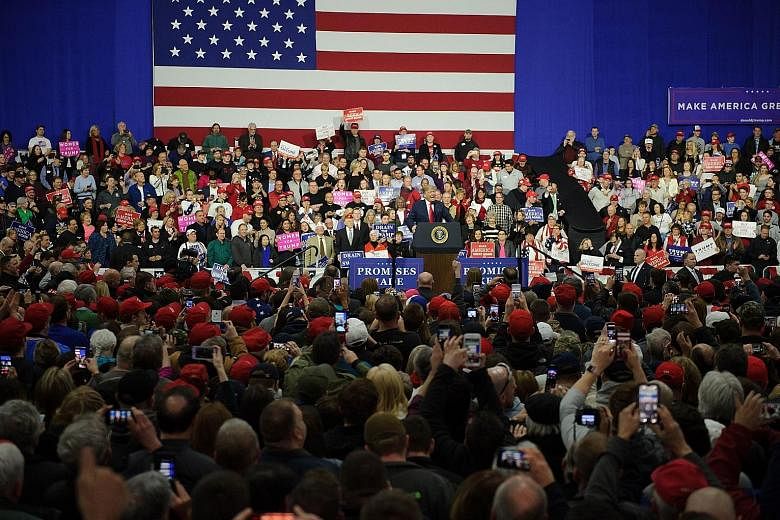 US President Donald Trump at a campaign event on Saturday in Moon Township, Pennsylvania, in support of Republican Rick Saccone, who is running for a US House seat. Mr Trump's call for executing drug dealers got some of the most enthusiastic cheers o