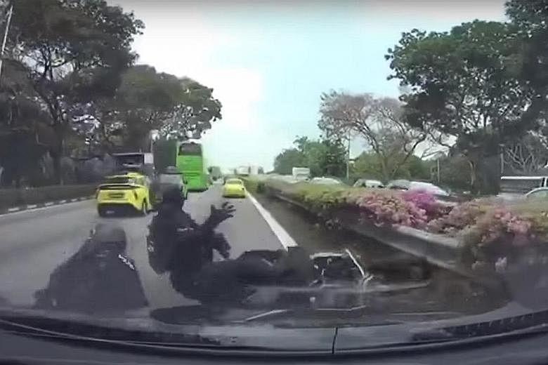 A video taken from a car's dashboard camera showing two motorcycles brushing against each other before toppling. The video ends with the police officers falling to the ground.