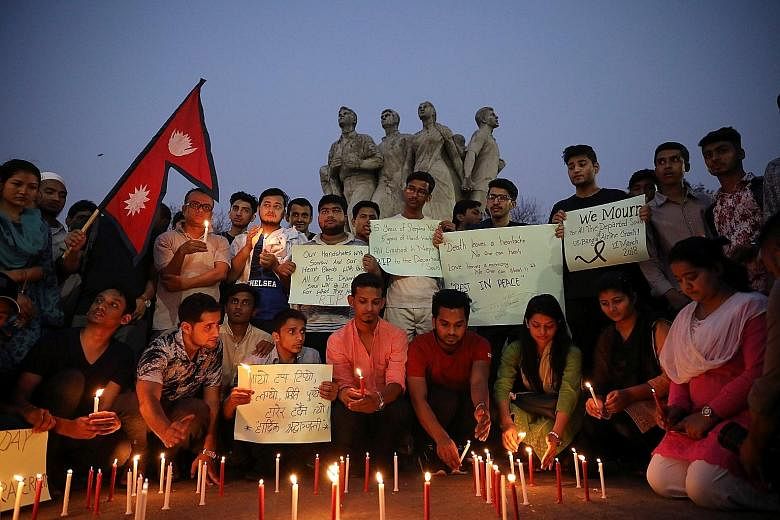 Nepali students of the University of Dhaka at a memorial for the victims of the fatal air crash.