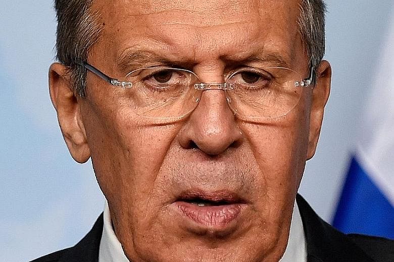 Investigators at work as part of the ongoing probe into the poisoning of a former Russian double agent and his daughter last week. Russian Foreign Minister Sergei Lavrov (above) has denied Moscow's involvement in the attack.