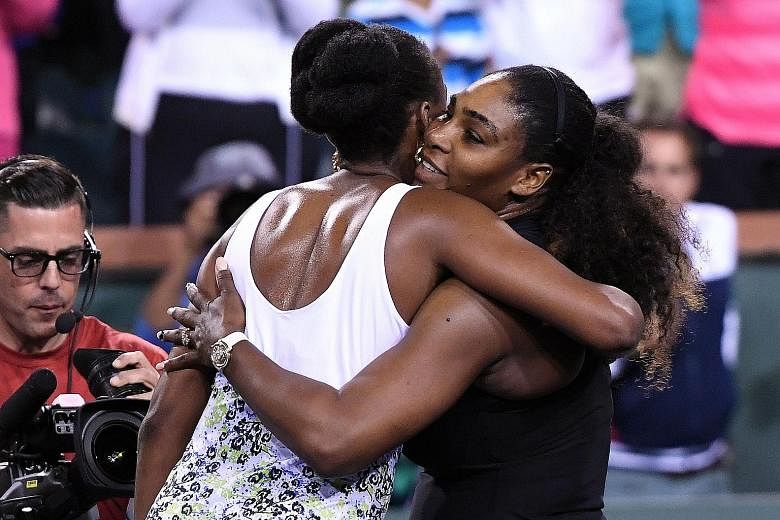 Serena Williams sharing a hug with sister Venus after their third-round Indian Wells clash. The younger Williams lost 3-6, 4-6 in her first official tournament since taking a year-long break to give birth to her daughter.