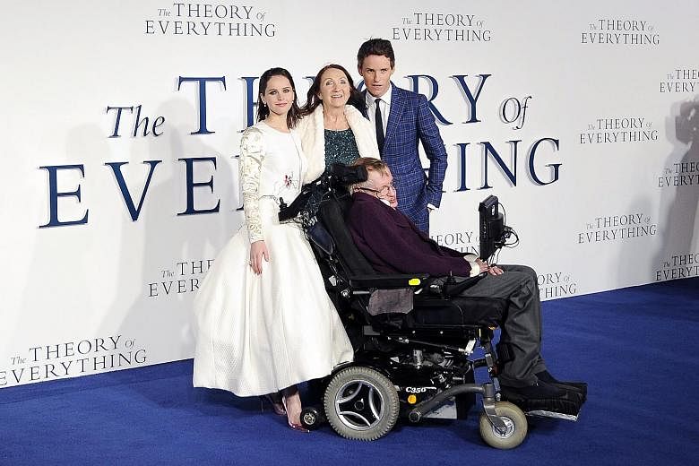 Left: Dr Stephen Hawking with (from left) actress Felicity Jones, his former wife Jane Wilde Hawking, and actor Eddie Redmayne at the UK premiere of The Theory Of Everything in 2014. Top: Dr Hawking and his new bride Elaine Mason in 1995. Above: Then