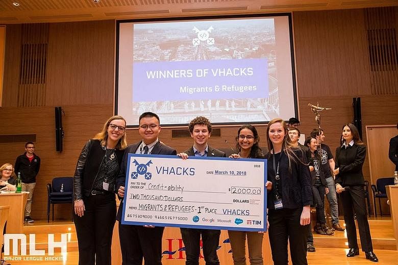 Ms Rushika Shekhar (second from right) and her team members (from left), Ms Lucy Obus, Mr Yanchen Wang, Mr Jake Glass and Ms Roisin McLoughlin at the VHacks hackathon in Vatican City. The team won with its credibility-scoring app that allows refugees