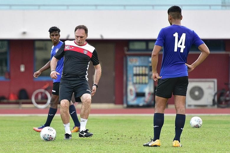 New Warriors FC coach Mirko Grabovac, a five-time S-League top scorer, showing how it is done during training at Choa Chu Kang Stadium. He arrived in Singapore on Jan 13 and received his employment pass a week ago.