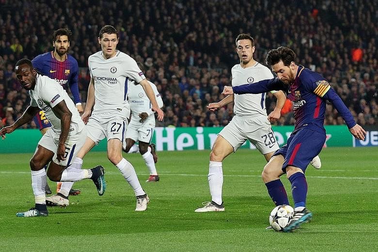 Above: Lionel Messi scoring Barcelona's third and his second of the night after the forward's burst of acceleration put him clear of the Chelsea backline of (from left) Victor Moses, Andreas Christensen and Cesar Azpilicueta. Left: The Argentinian em