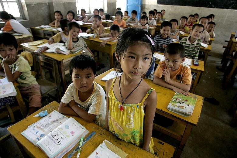 Pupils in a Hainan school. Improving the quality of education is a pillar of China's plans for "national rejuvenation" and seen as a key to lifting millions out of poverty and transforming the nation into a country of innovators.