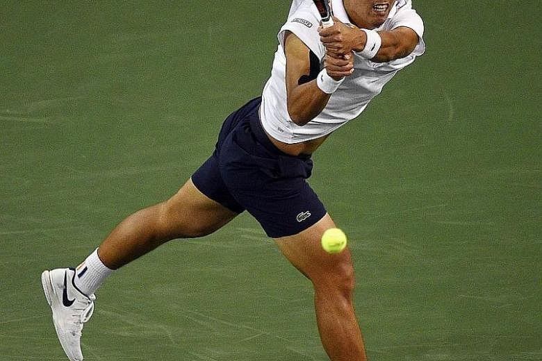 South Korea's Chung Hyeon hitting a running backhand against Roger Federer on Thursday. The Swiss world No. 1 won 7-5, 6-1 to move into the semi-finals at Indian Wells with a 16-0 unbeaten streak this year.