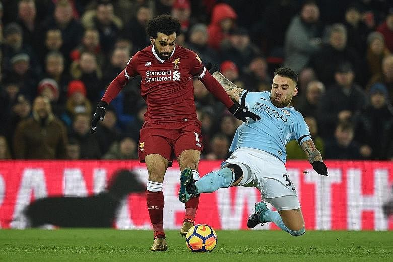 Manchester City defender Nicolas Otamendi (right) tackling Liverpool forward Mohamed Salah during the 4-3 Premier League home win for the Reds in January.