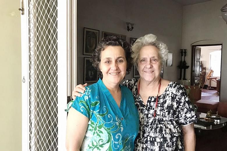 Above: The Jewish cemetery in Kolkata. There are only about 20 Jews living in the city now. Left: Historian Jael Silliman and her mother, Mrs Flower Silliman, in their home in Kolkata.