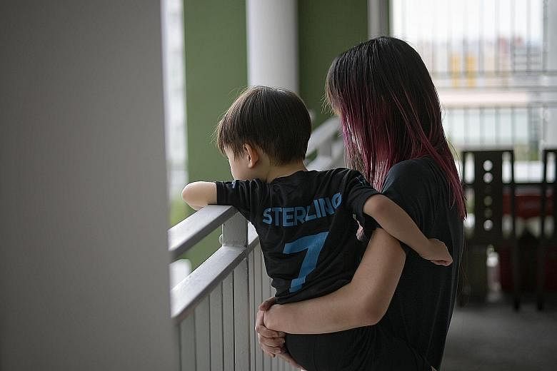Ms Michelle Lim with her three-year-old son. The 23-year-old, who runs her own logistics business, does not feel that laws stipulating a minimum age for abortion or parental consent will help teenage mums like herself. She says she would not have had