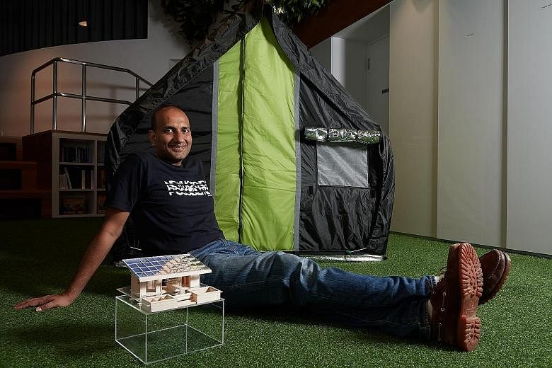Mr Prasoon on a visit to Diggi Tanda village in India. billionBricks has worked on about eight projects and settled at least 4,000 homeless in several countries. Mr Prasoon Kumar at his office in Fusionopolis, with the all-season weatherHYDE tent tha