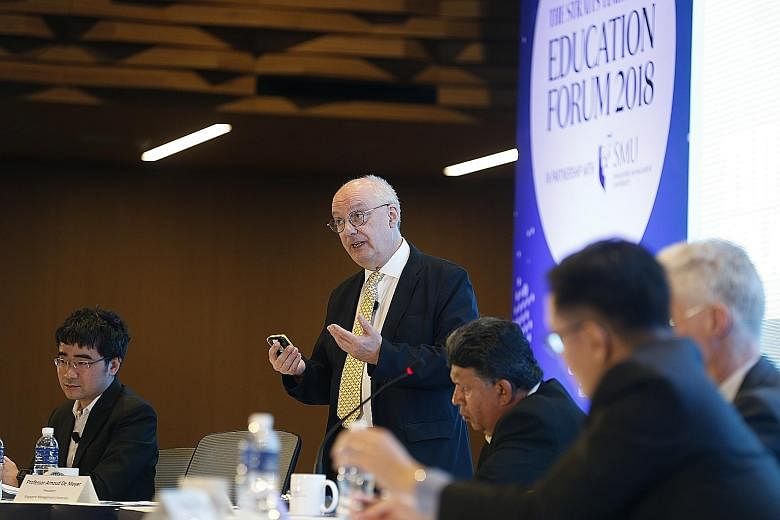 From left: Singapore Management University law dean Goh Yihan and SMU president Arnoud De Meyer argued against the motion "You don't need a degree to succeed in life" at the Straits Times Education Forum yesterday. On the opposing team were OECD dire