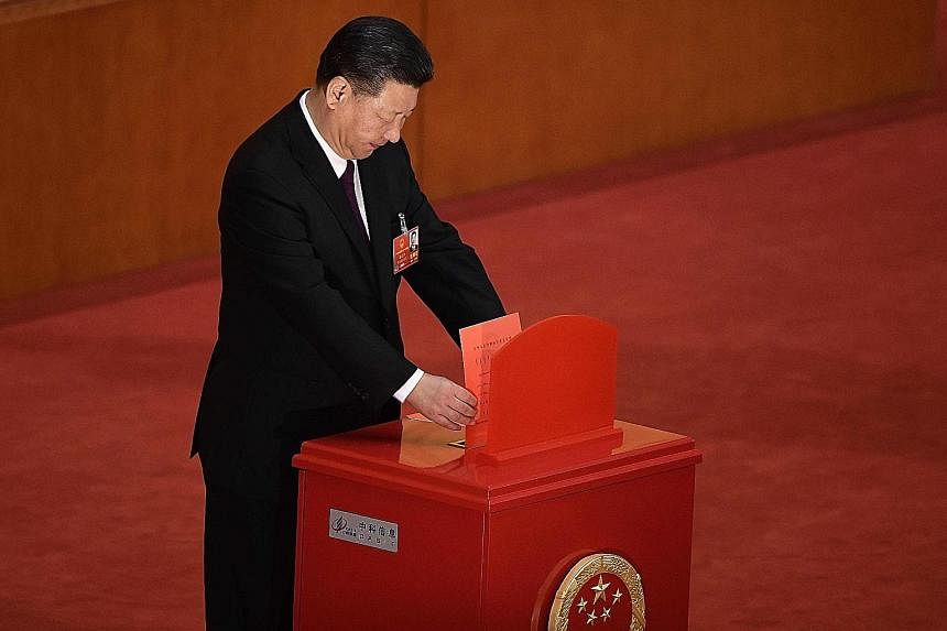 President Xi Jinping casting his vote at the NPC session. He has been unanimously elected to a second term, days after the lifting of presidential term limits allowed him to stay in office indefinitely. Delegates lining up to vote during the fifth pl