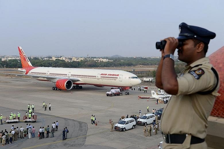 An Air India plane on the tarmac during an airshow at Begumpet Airport in Hyderabad. The Sydney-based Centre for Aviation estimates that India needs to invest US$45 billion (S$59 billion) by 2030 to keep up with air travel demand.