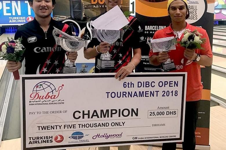 Runner-up Muhd Jaris Goh (left) and champion Jonovan Neo, both of Singapore, with their trophies.