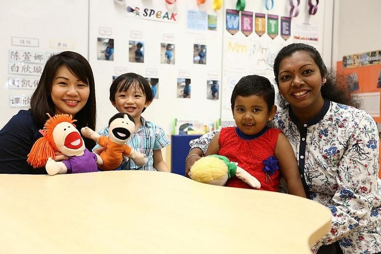 Madam Rachel Ong with her son Lukas Liew and Mrs Mohanraj Vasantharany with her daughter Akshekha Mohanraj at the MOE kindergarten at West Spring Primary School. Madam Ong is willing to move her son from a private kindergarten to the MOE kindergarten