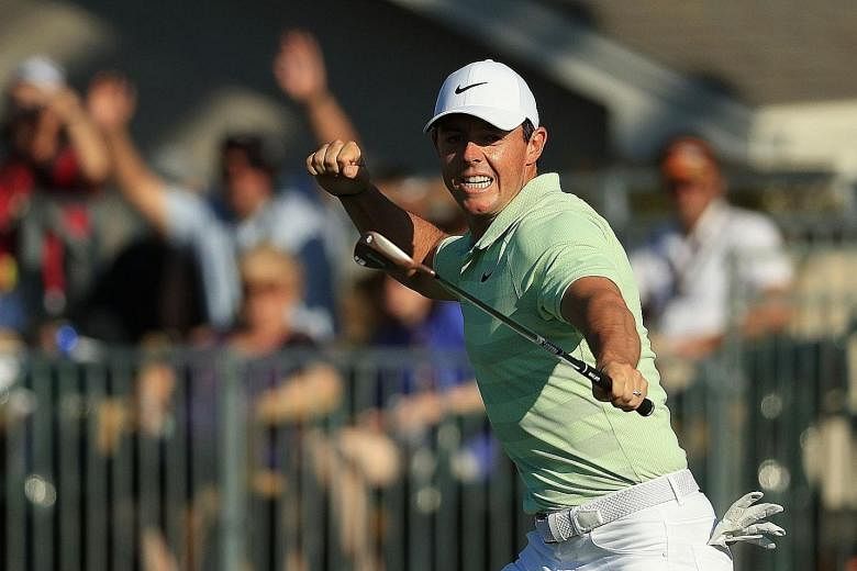 Rory McIlroy punches the air after winning the Arnold Palmer Invitational on 18 under, three strokes ahead of Bryson DeChambeau. Tiger Woods, an eight-time winner of the event, was eight shots adrift.