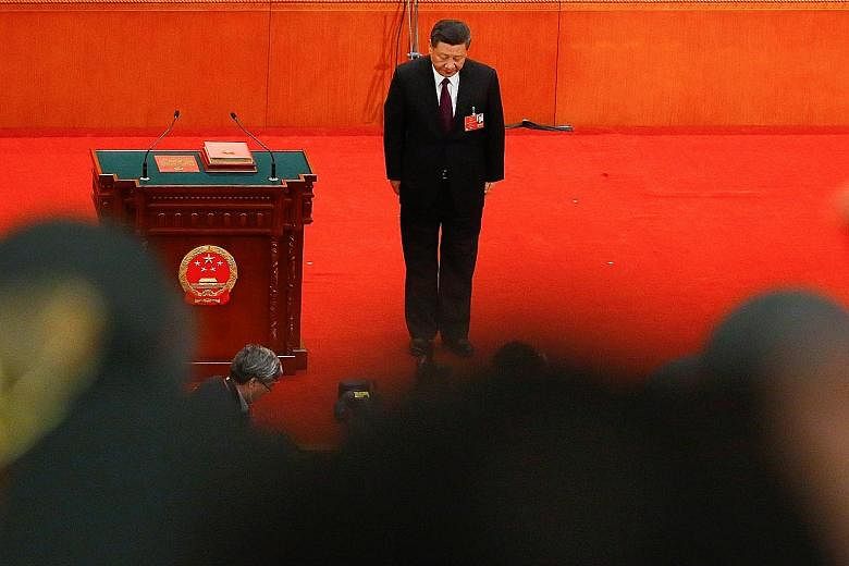 Chinese President Xi Jinping, after being elected for another term, at the National People's Congress last Saturday. Analysts say the uncertainty of the Trump administration is a big opportunity for China.