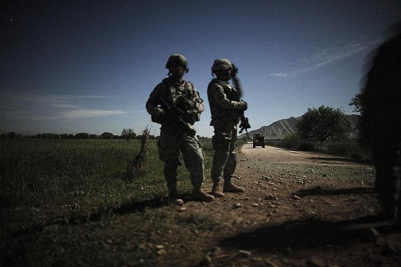 US military quick response soldiers stand guard with night vision goggles in Afghanistan in April 2010. Soldiers in the field still do not have new night vision goggles that could save lives.