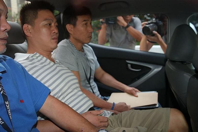 Odd-job worker Lim Ying Siang (in striped shirt) pleaded guilty to one count each of committing mischief by fire and drug consumption.