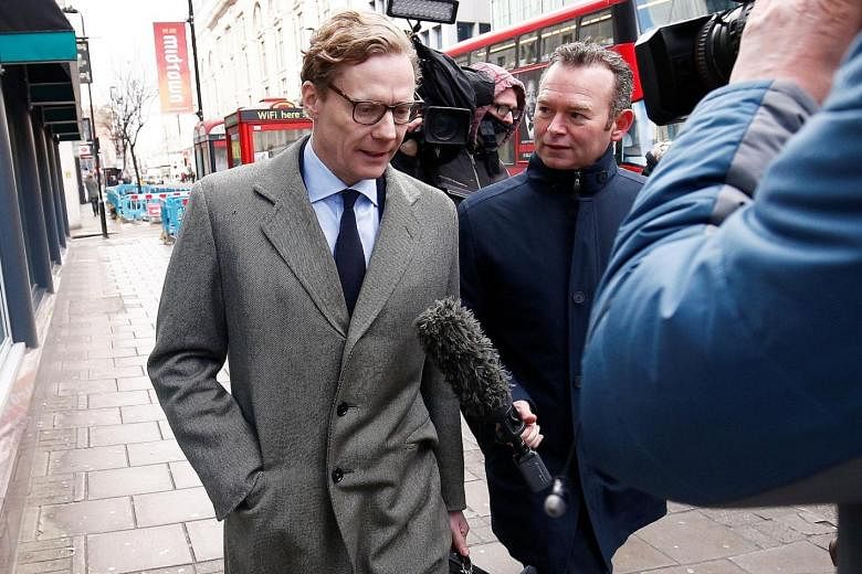 Cambridge Analytica's CEO Alexander Nix (far left) and executive Mark Turnbull were secretly filmed by Channel 4 News boasting about entrapping politicians using honey traps and running fake news campaigns.