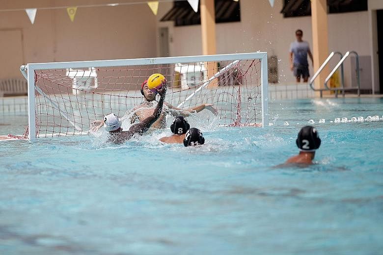 An Anglo-Chinese School (Independent) player taking aim at goal in yesterday's Schools National B Division water polo final. ACS(I), last year's runners-up after a stunning upset by Outram Secondary, defeated Hwa Chong Institution 10-3 at the Co-Curr